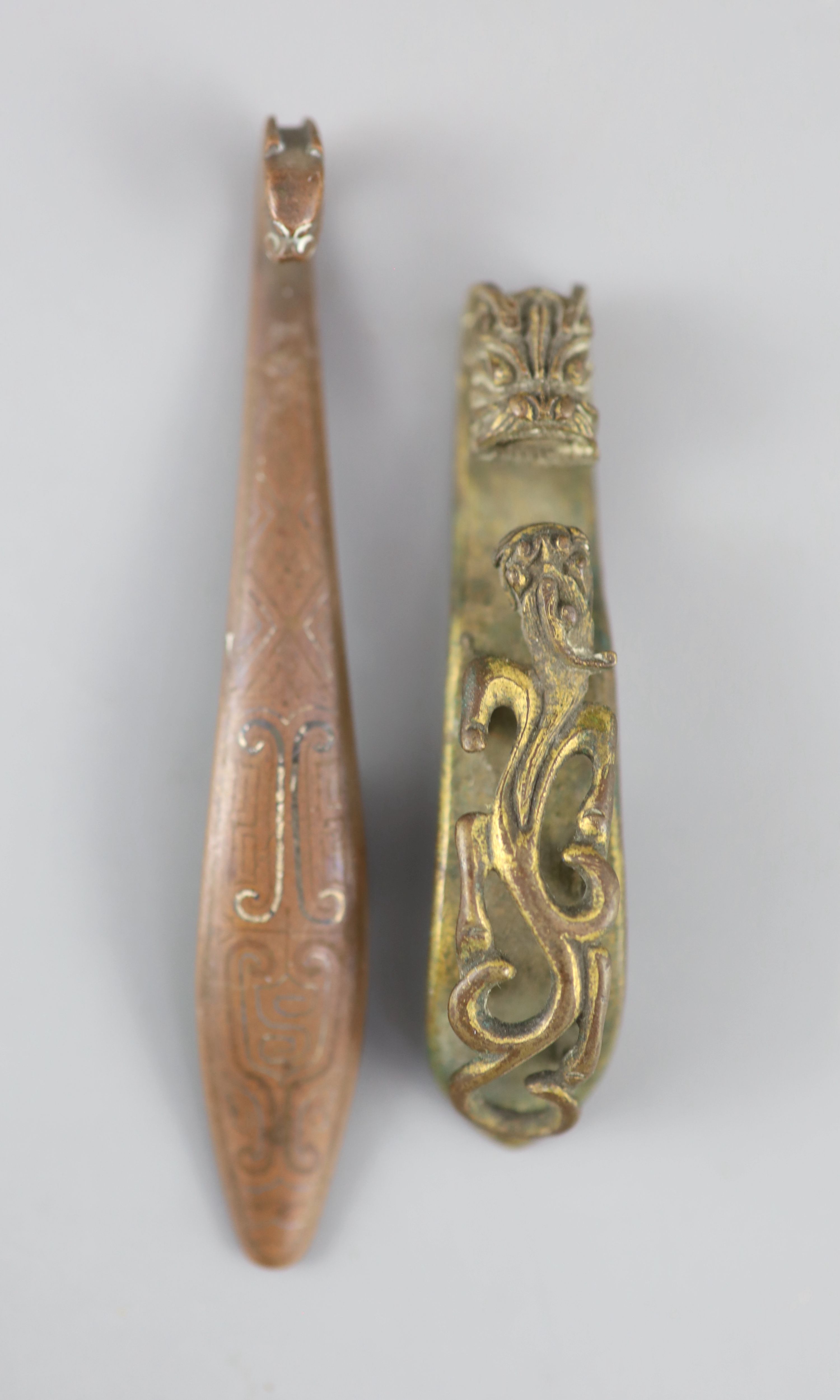 A Chinese archaistic silver and copper inlaid bronze belt hook and a bronze chilong belt hook, 18th/19th century,